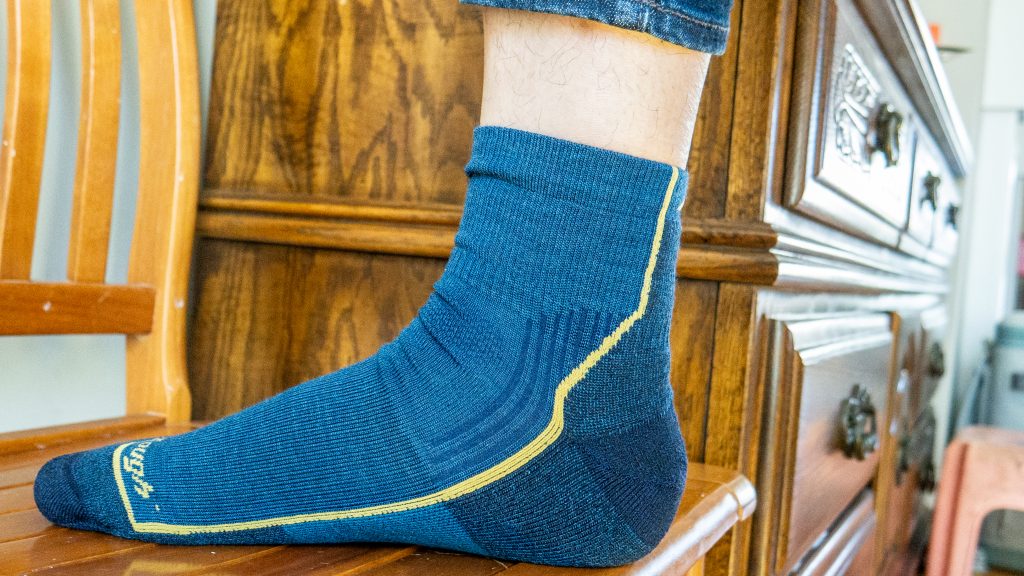 Foot on chair, weaning Darn Tough Socks