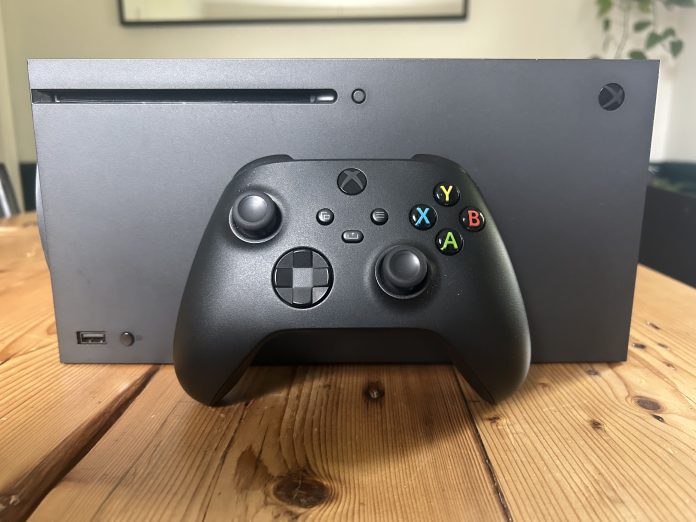 an xbox series x console, and a core xbox controller