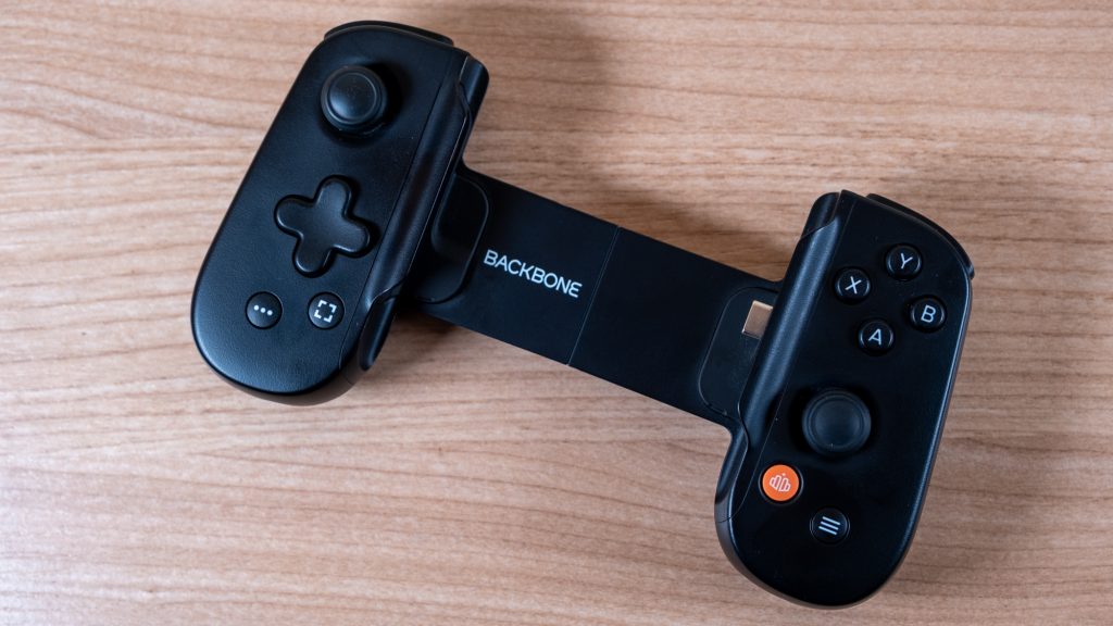 Black Backbone One controller on a wooden table.
