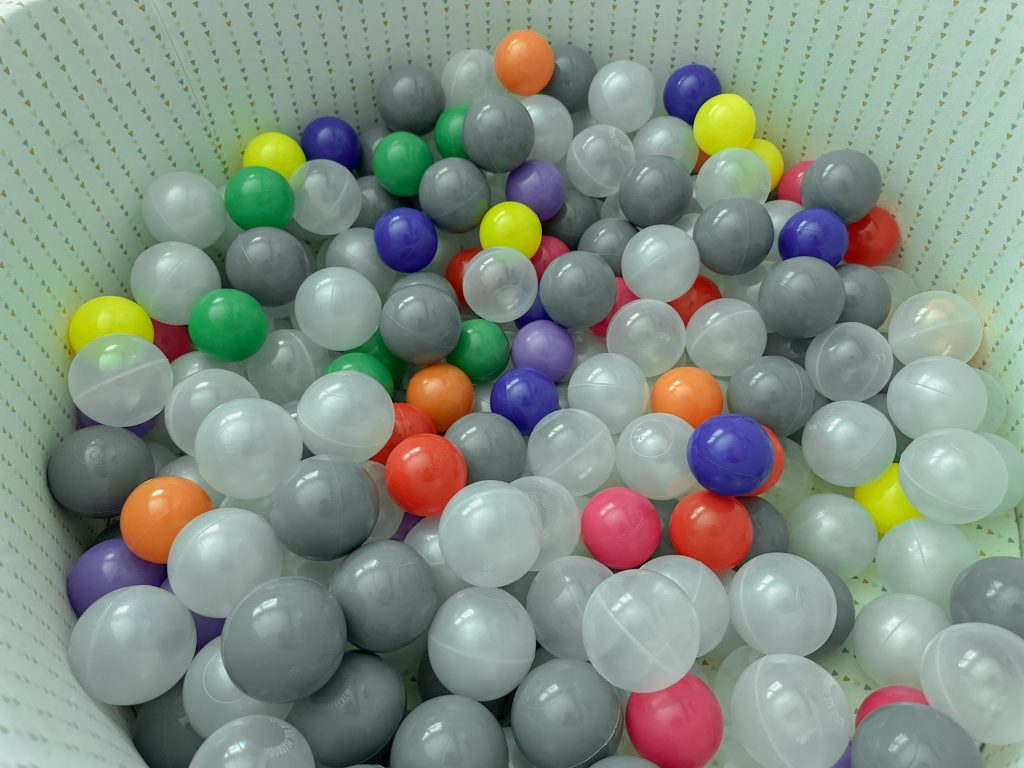 plastic balls of various colors in a pit