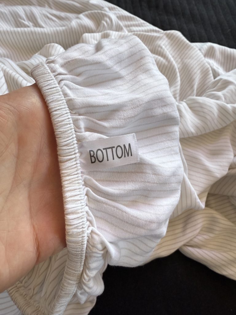 Bottom tag sewn onto Cozy Earth bamboo fitted sheet.