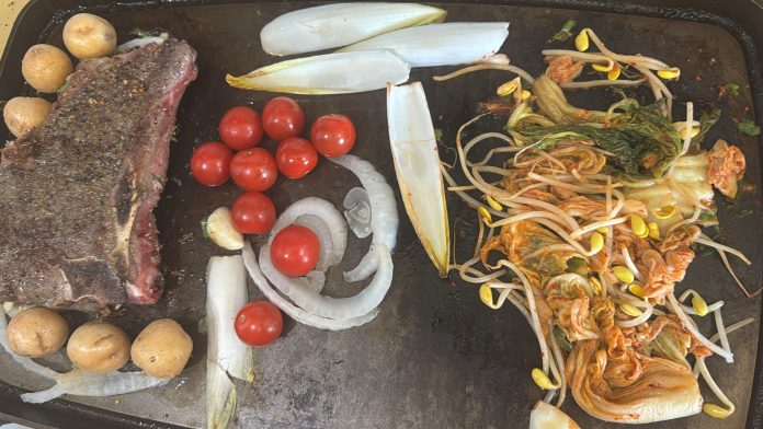 smithey-double-burner-griddle-18-inch-cast-iron-cooking-dry-aged-t-bone-steak-potatoes-cherry-tomatoes-onions-soy-beans-kimchi-after