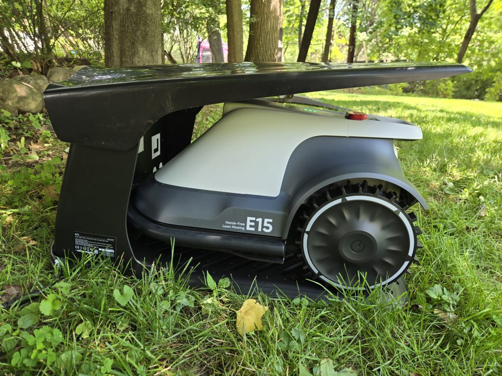 Eufy E15 robot lawn mower charging in base station