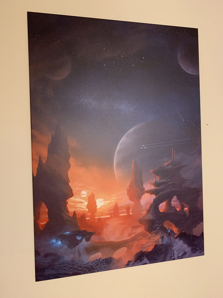 a Displate metal poster with a space scene of the Stellaris game