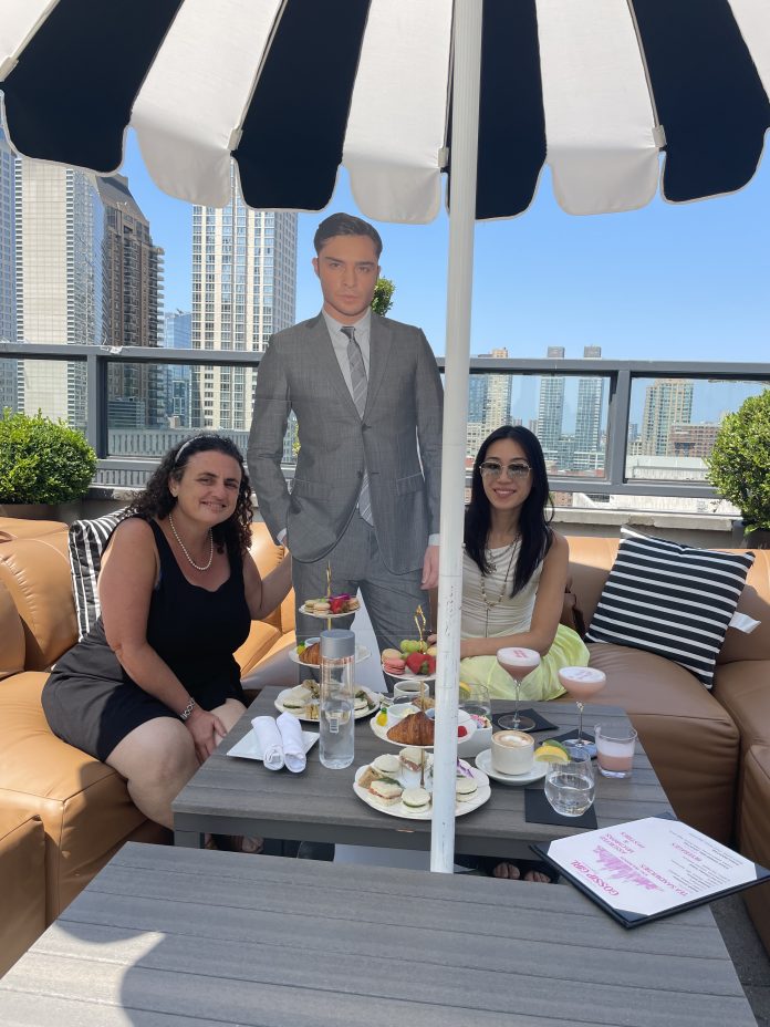 Reyna Gobel and Crystal Yang enjoy the Gossip Girl Experience with Chuck Bass cut out