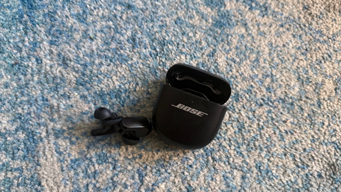 bose earbuds on carpet