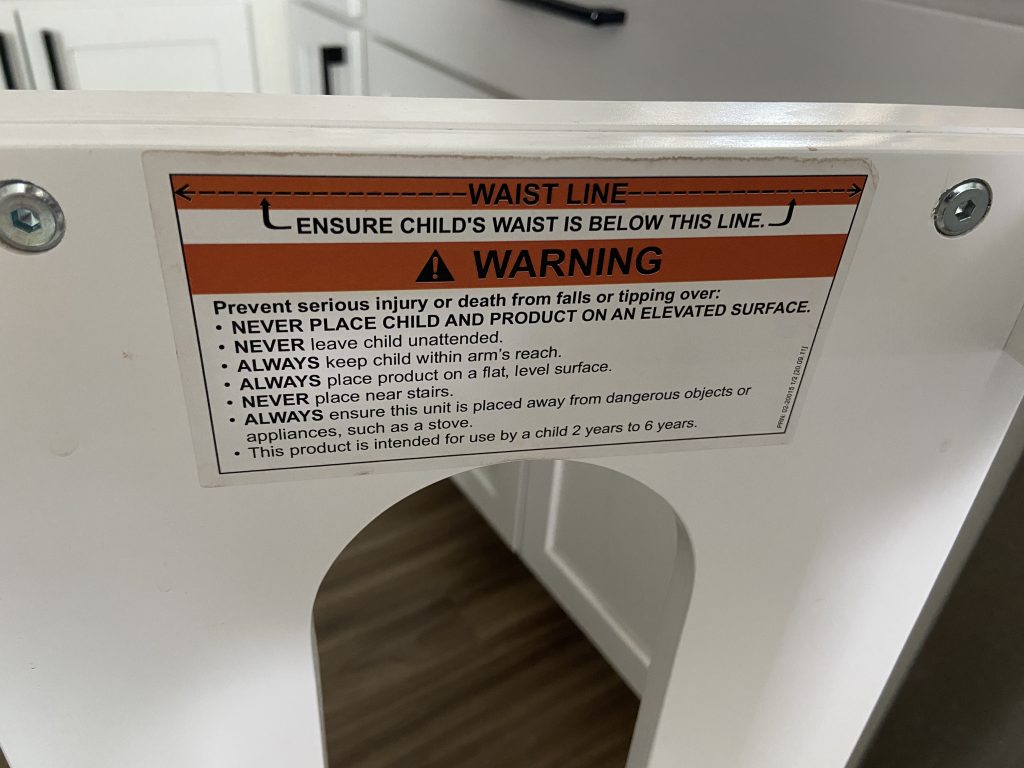warning sticker for where child's waist should be