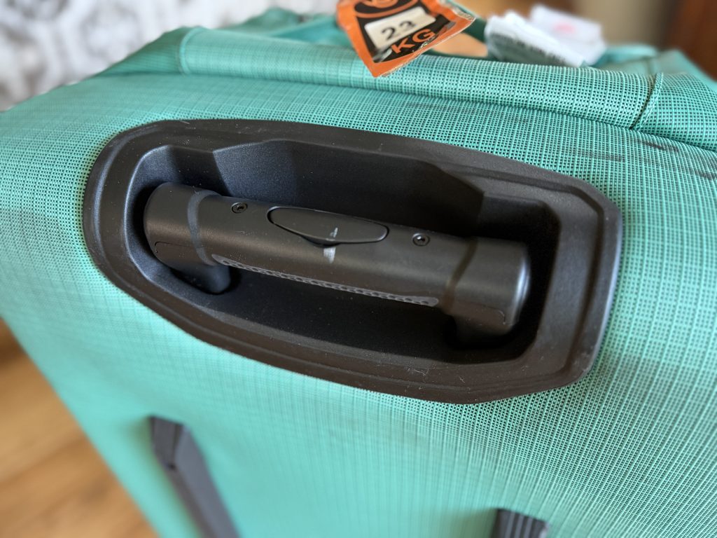 Close up of the telescoping handle on the Black Hole Wheeled Duffle Bag.