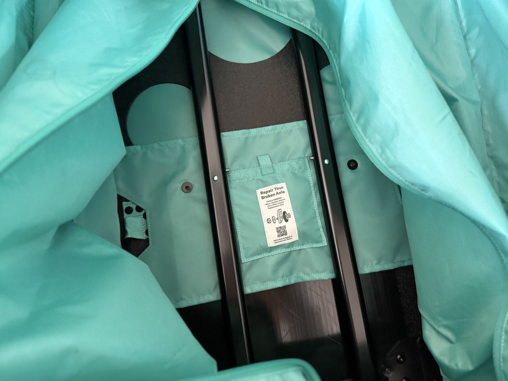The repair area of the Black Hole Wheeled Duffel 100L bag.