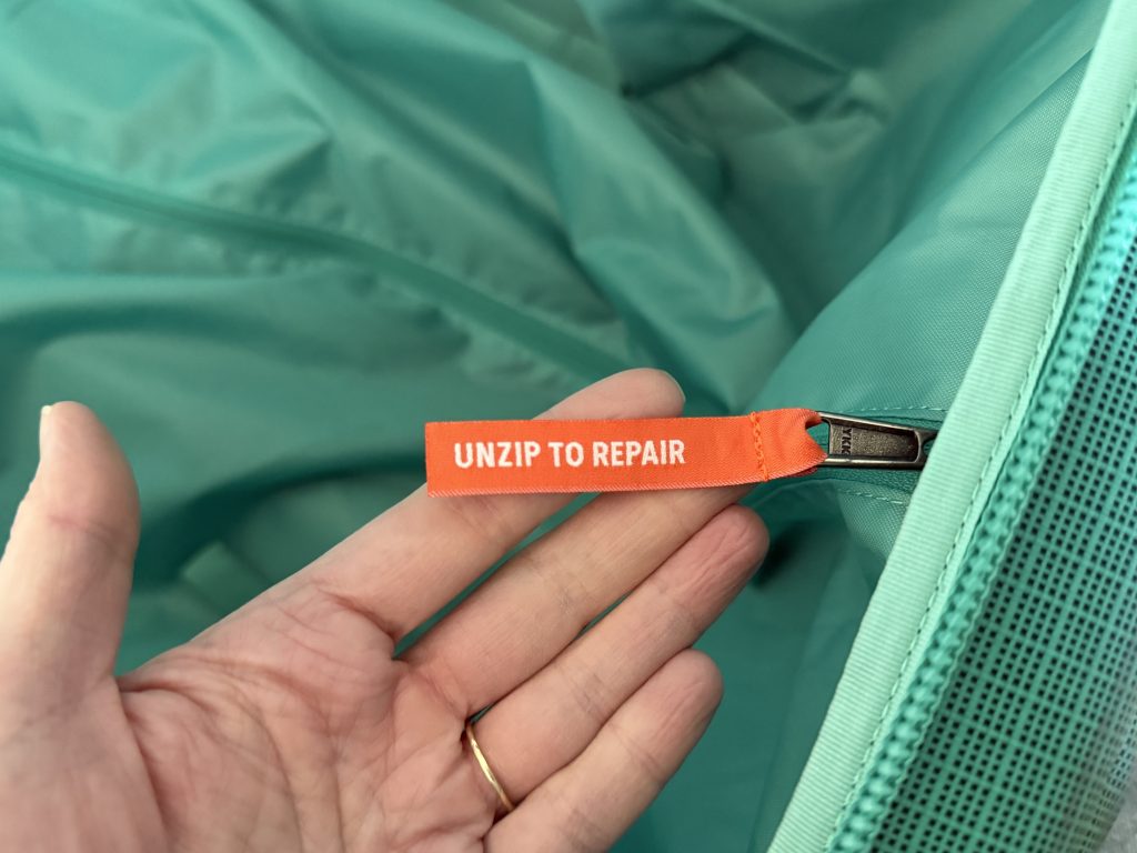 A close-up of the zipper inside the Black Hole Wheeled Duffel 100L bag.